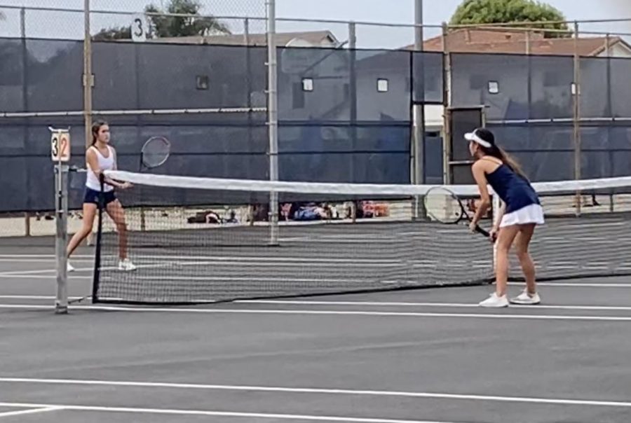 A player on the JV Girls Tennis Team battling it out this month on the new tennis courts.