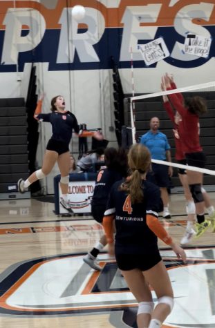Outside hitter Zoey Henson leaps for the spike.