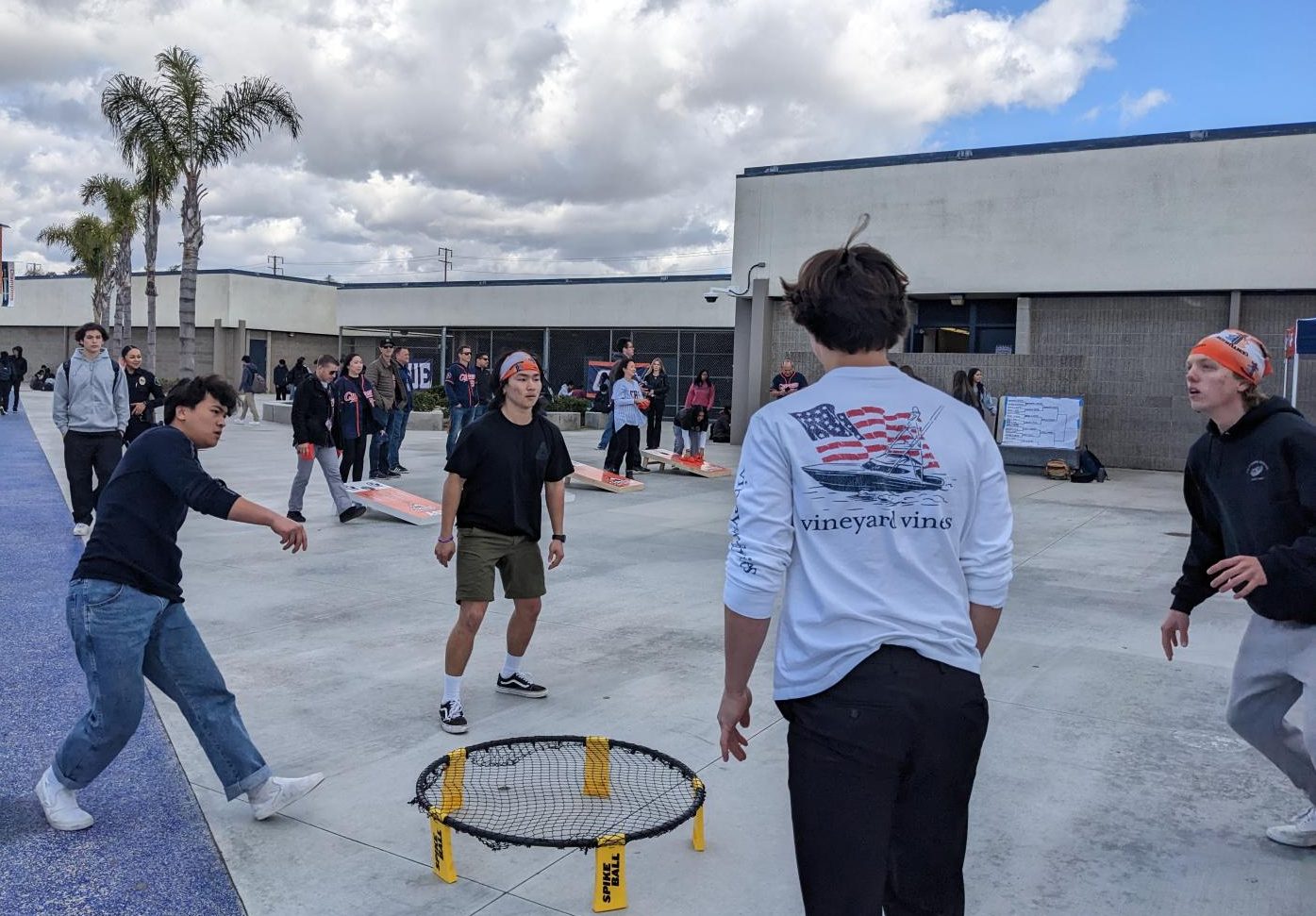 Orange and Blue team going at each other in  Spike ball.
