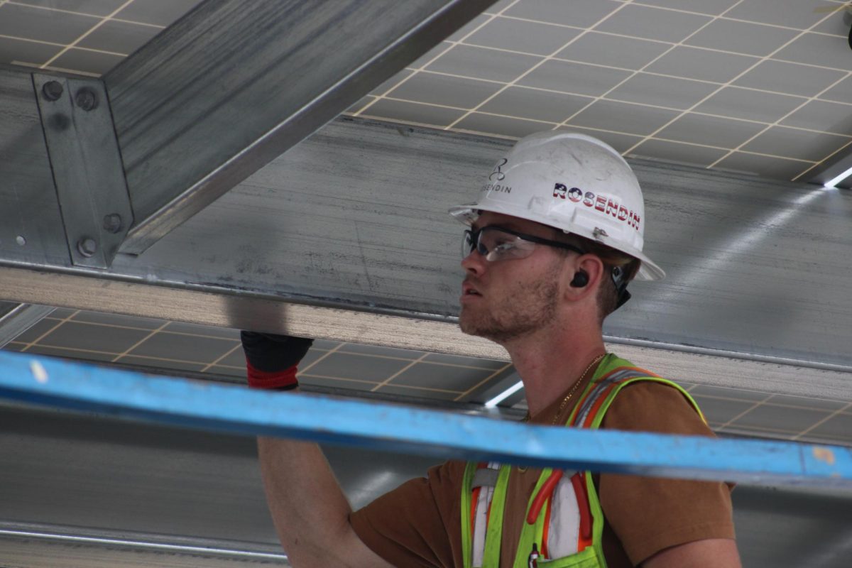 Construction workers are finishing up the solar panels, despite the recent theft.