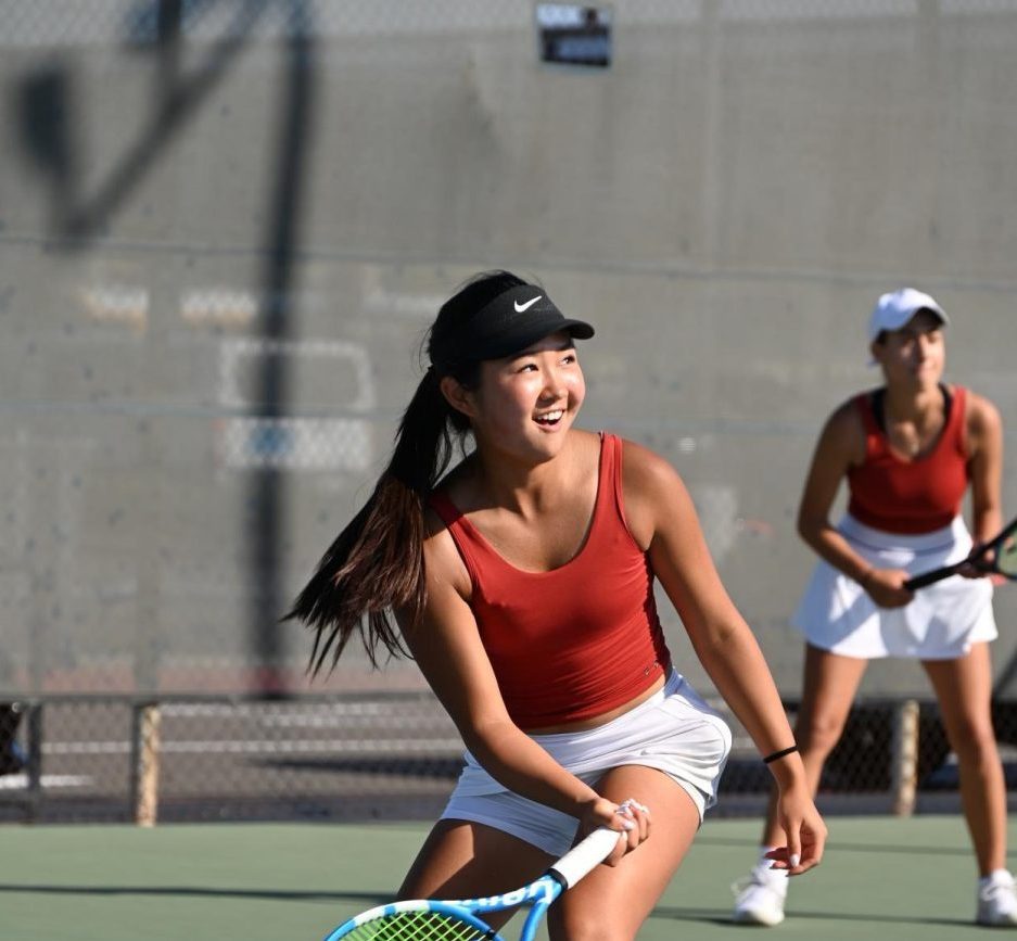 Junior Ashley Park swings for the ball showing off her skills on the court.