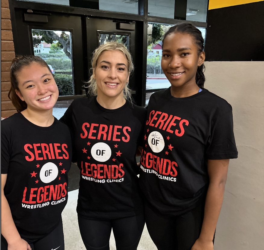 Captain Alice Kim and Junior Bella Lyres pose with Helen Maroulis, an Olympic gold wrestling medalist.