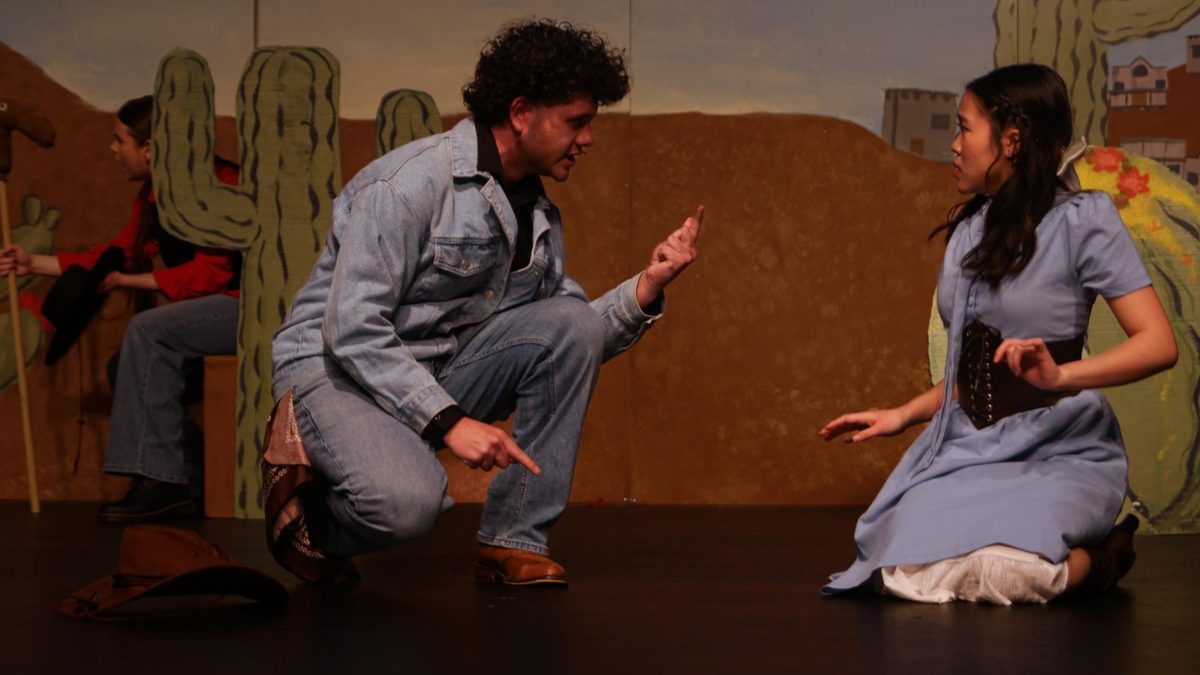 Dorian Carrillo Ferrer and Natalie Uy play Lysander and Helena, two members of a complex love triangle. 