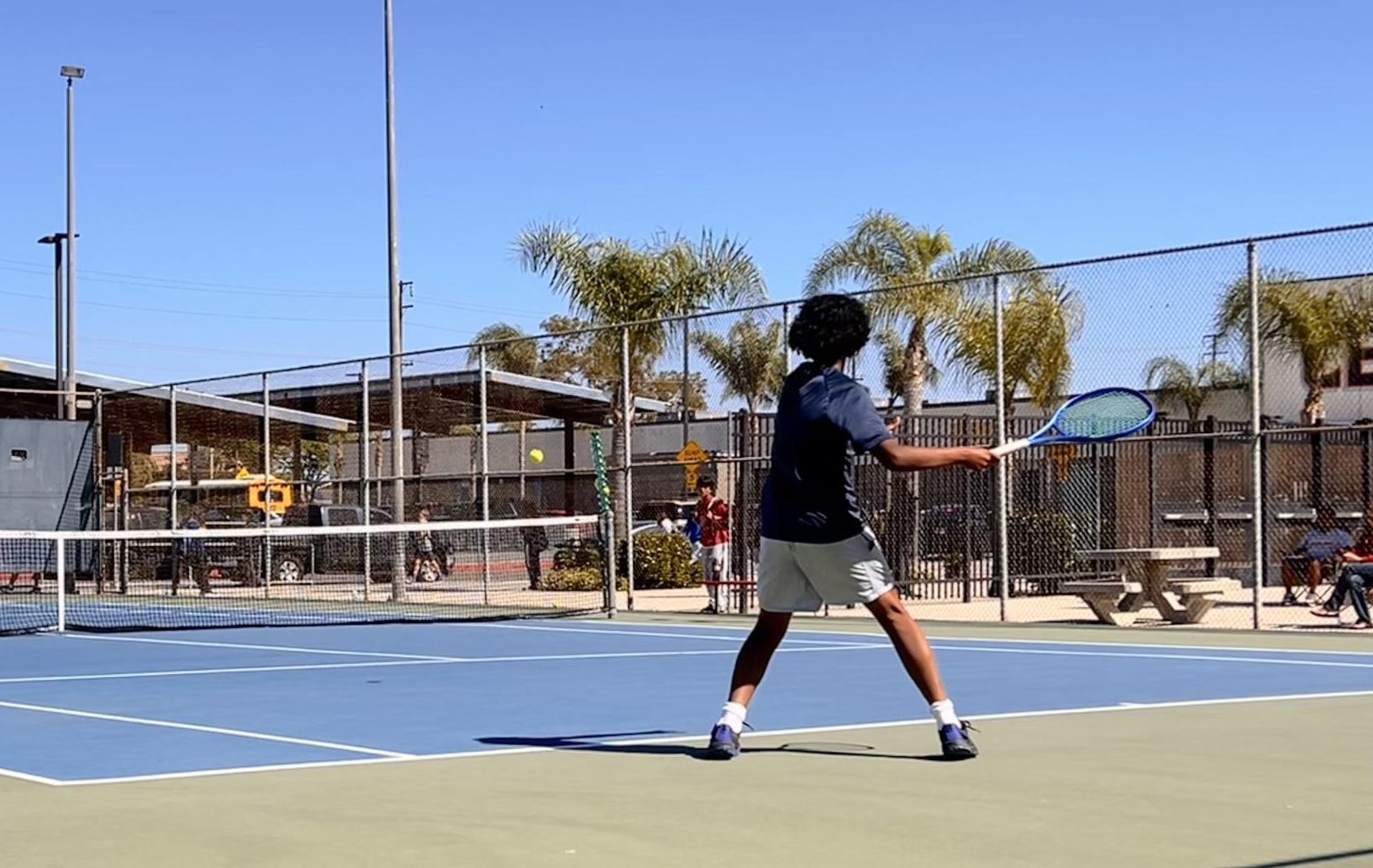 Varsity Boy's Tennis fights valiantly against El Modena.